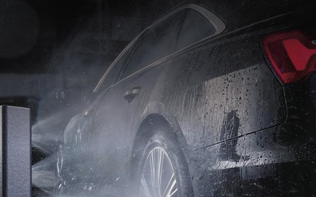 Underbody and wheel arch being cleaned by high-pressure jets